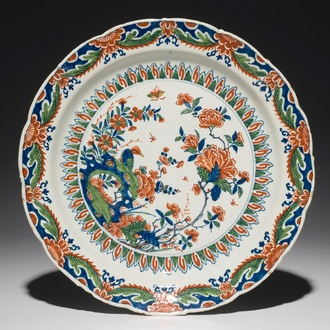 A Dutch Delft cashmire palette dish with a bird and insects among flowers, 1st half 18th C.